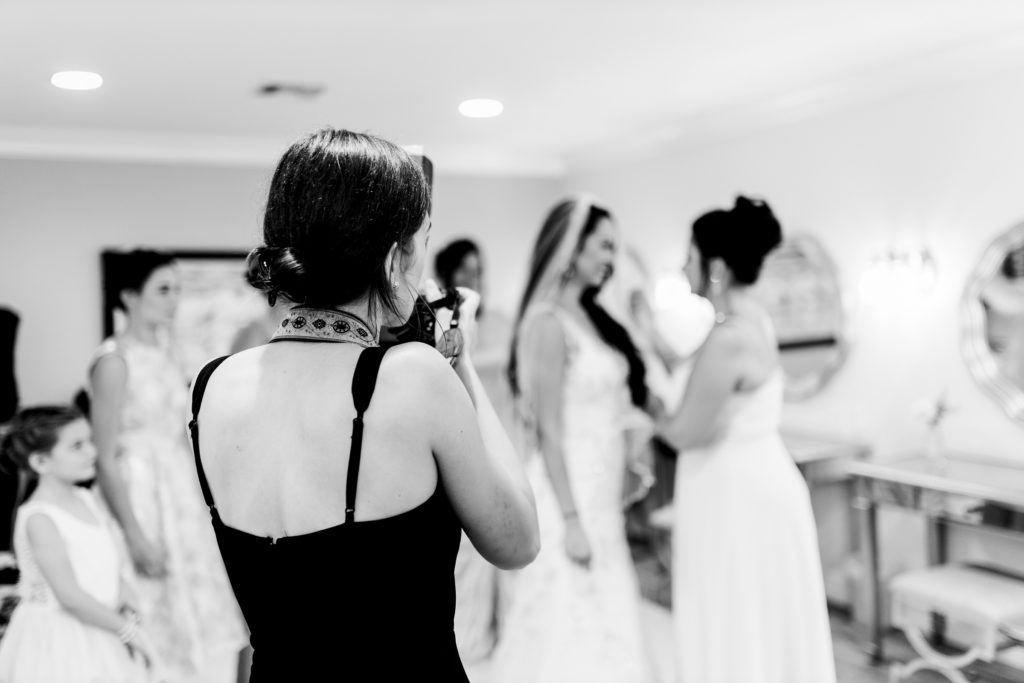 Angelika Krug taking photos at a wedding