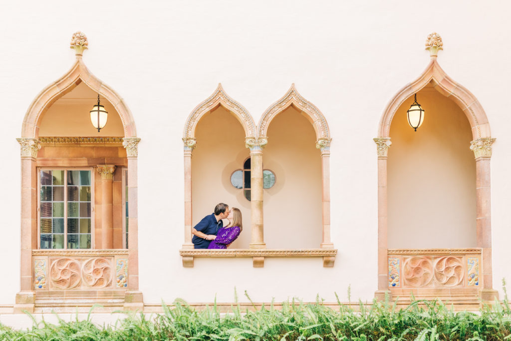 Engagement session with couple in arches of Ringling Museum